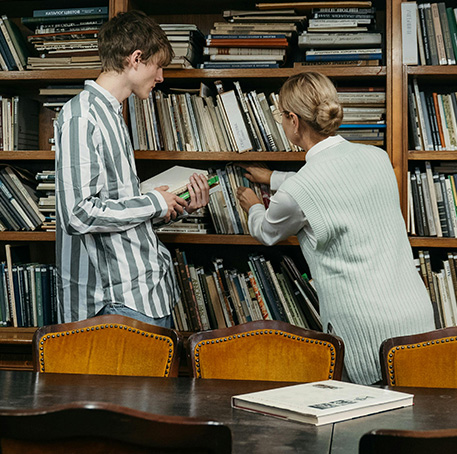 two people browsing books