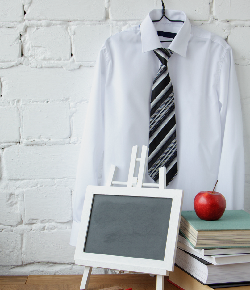 school attire background with red apple